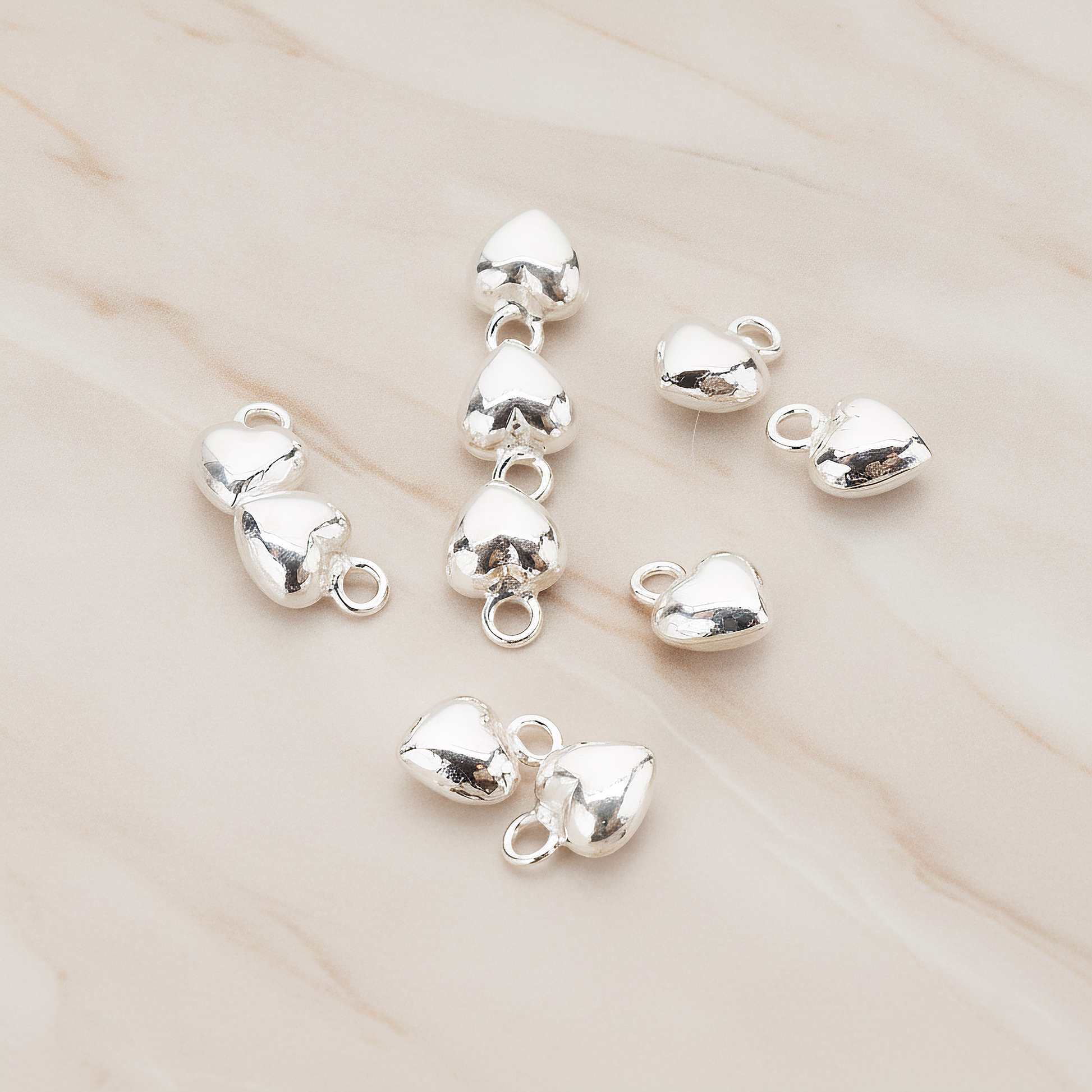 925 Sterling Silver Mini Heart Pendant, 2 Pc on warm marble background (PD.1057)