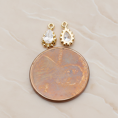 Teardrop Framed Cubic Setting Pendant, 2 Pc on warm marble background (PD.1076)