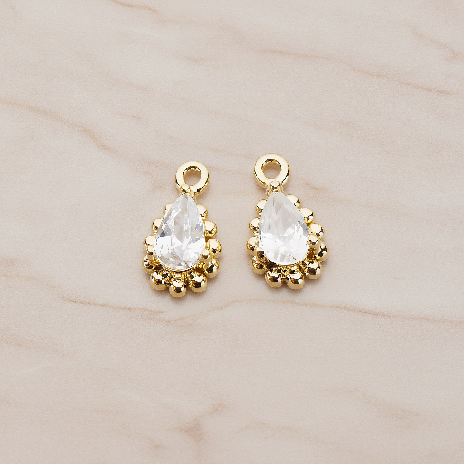 Teardrop Framed Cubic Setting Pendant, 2 Pc on warm marble background (PD.1076)
