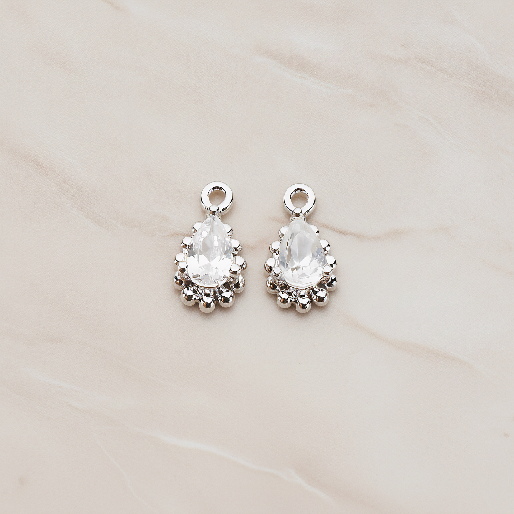 Teardrop Framed Cubic Setting Pendant, 2 Pc on warm marble background (PD.1076)