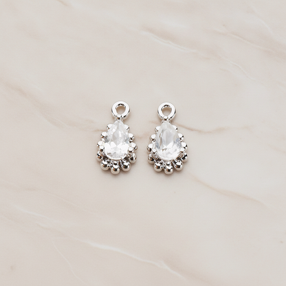 Teardrop Framed Cubic Setting Pendant, 2 Pc on warm marble background (PD.1076)
