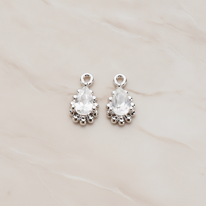 Teardrop Framed Cubic Setting Pendant, 2 Pc on warm marble background (PD.1076)