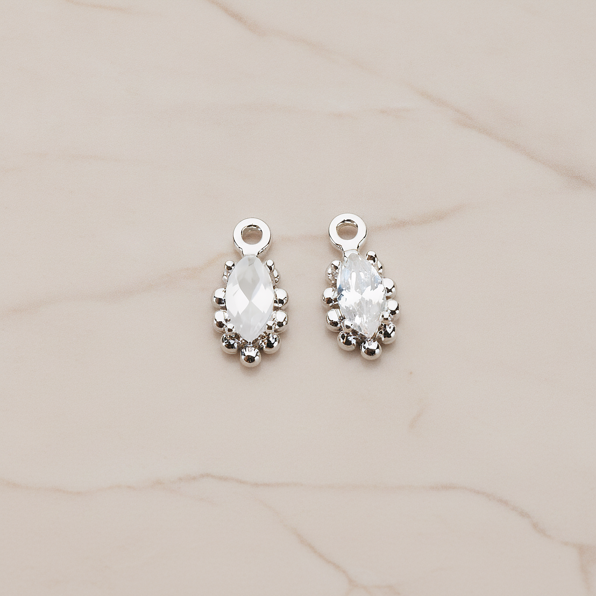 Oval Framed Cubic Setting Pendant, 2 Pc on warm marble background (PD.1077)
