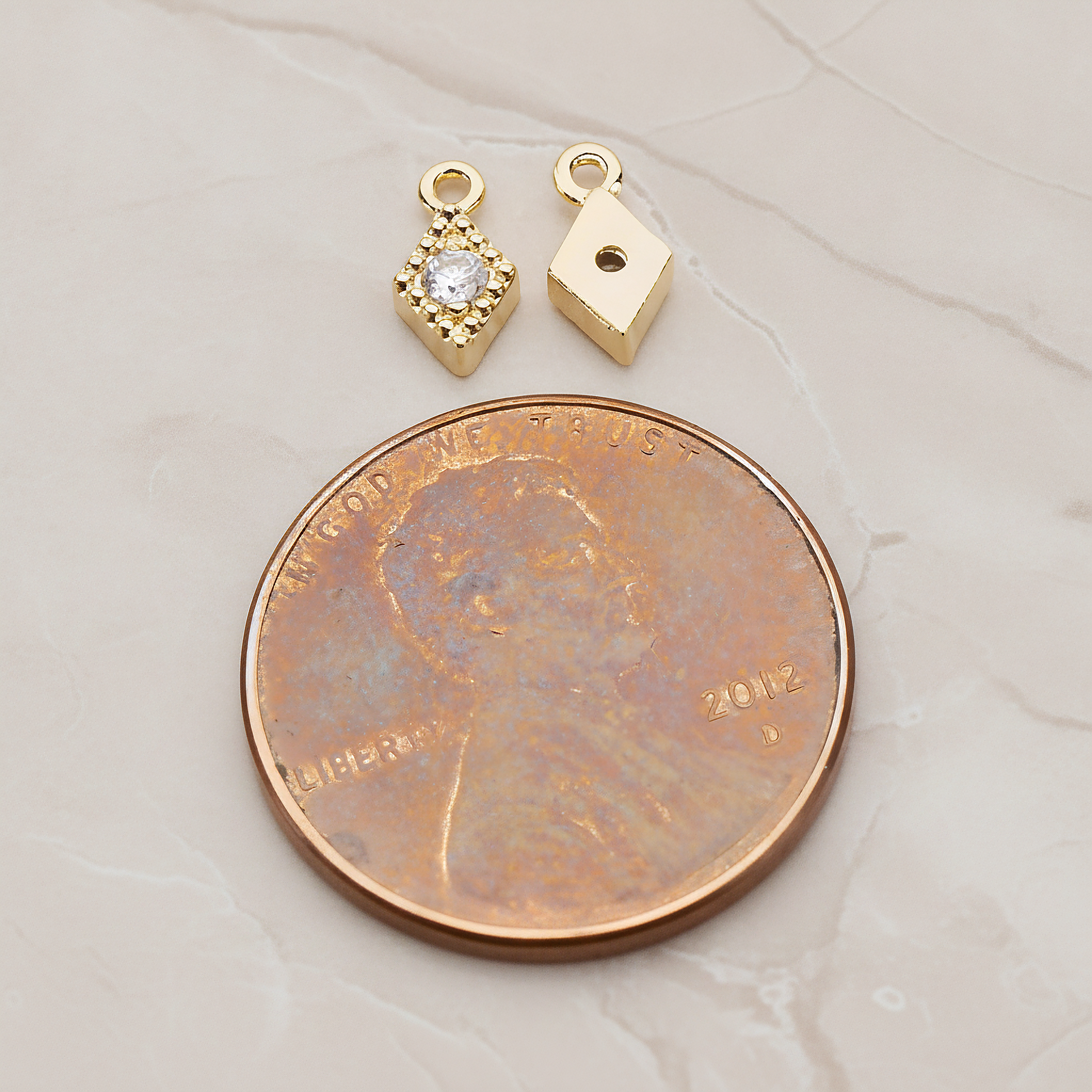 Diamond Shaped Framed Cubic Setting Pendant, 2 Pc on warm marble background (PD.1080)