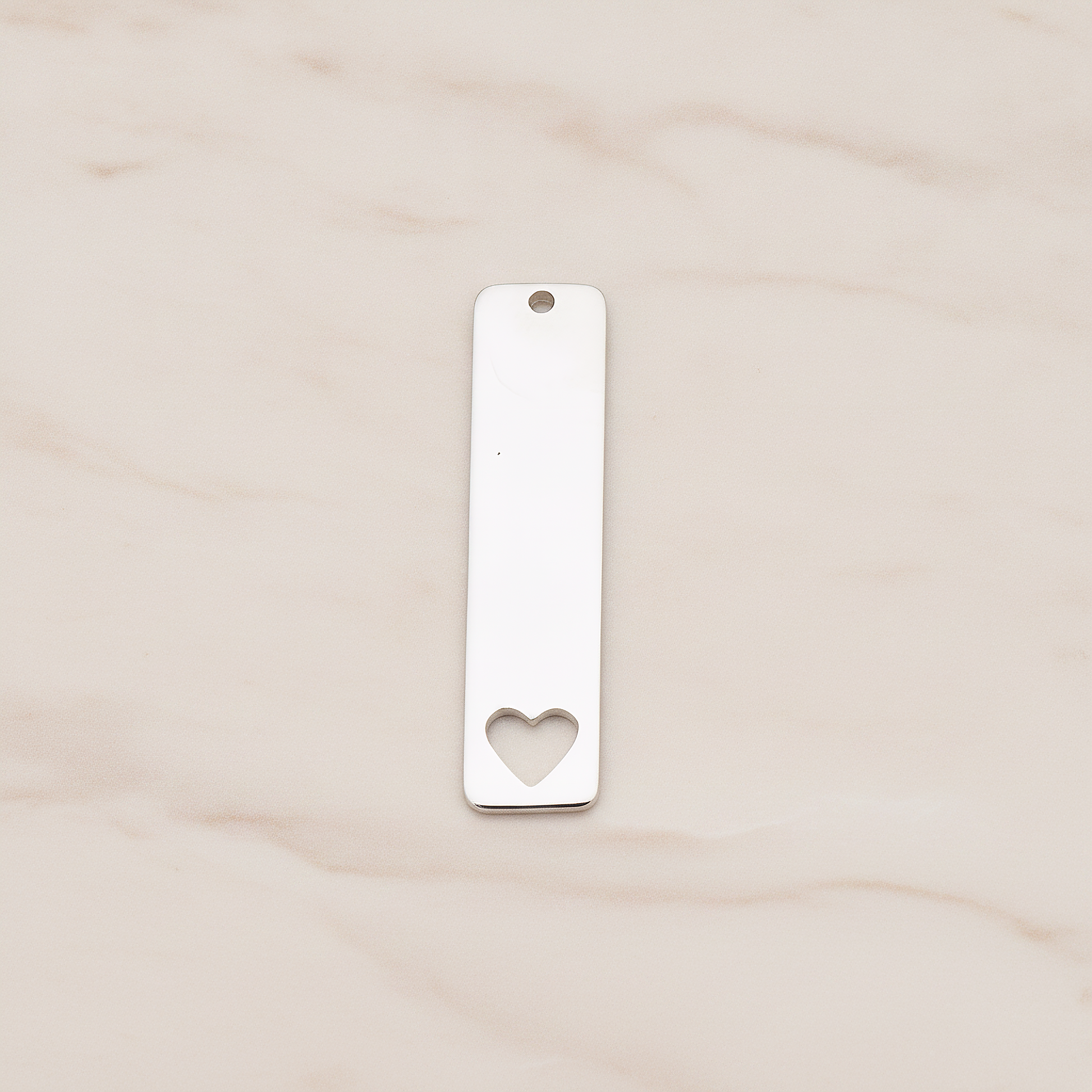 Vertical Heart Silhouette Bar Pendant, 2 Pc on warm marble background (PD.1150)
