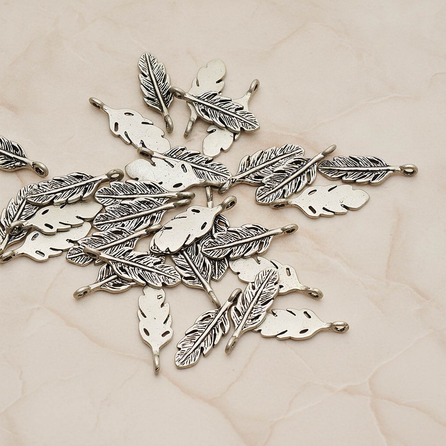 Mini Feather Pendant, 2 Pc on warm marble background (PD.1173)