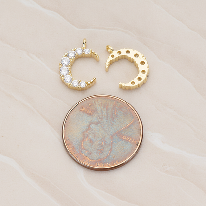Round Crystal Cut Cubic Zirconia Crescent Moon Pendant, 2 Pc on warm marble background (PD.1174)