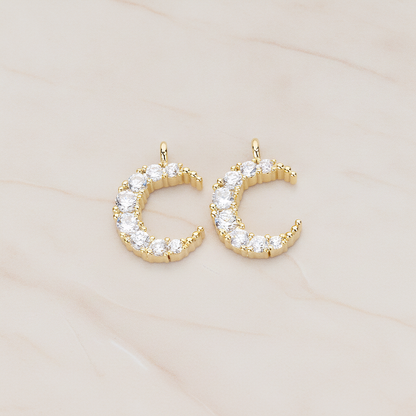Round Crystal Cut Cubic Zirconia Crescent Moon Pendant, 2 Pc on warm marble background (PD.1174)