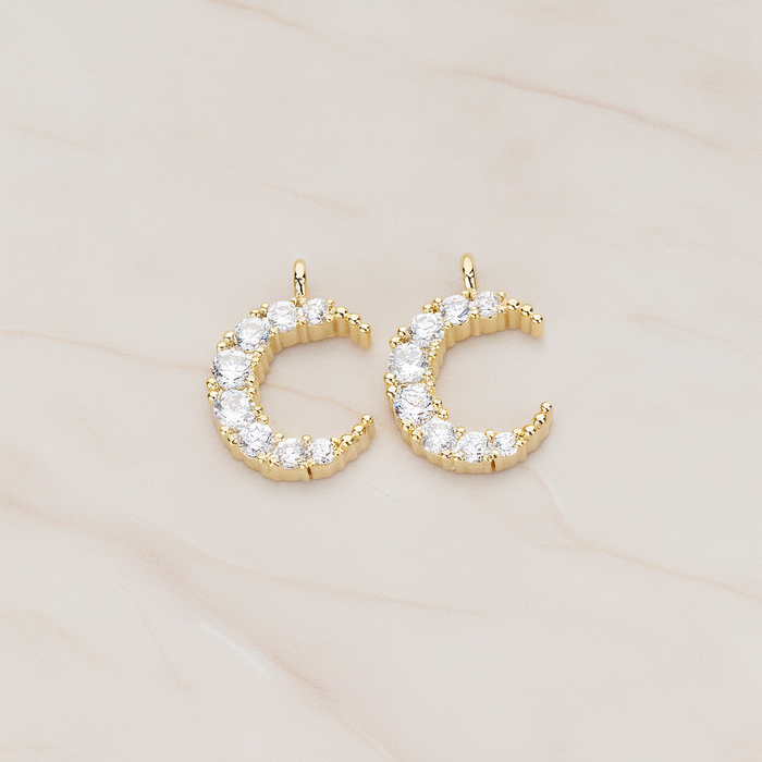 Round Crystal Cut Cubic Zirconia Crescent Moon Pendant, 2 Pc on warm marble background (PD.1174)