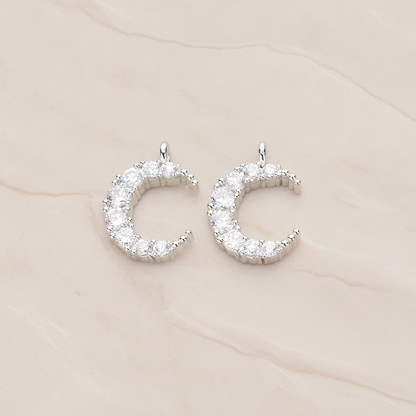 Round Crystal Cut Cubic Zirconia Crescent Moon Pendant, 2 Pc on warm marble background (PD.1174)