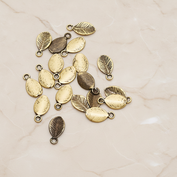 Mini Oval Leaf Pendant, 6 Pc on warm marble background (PD.1208)