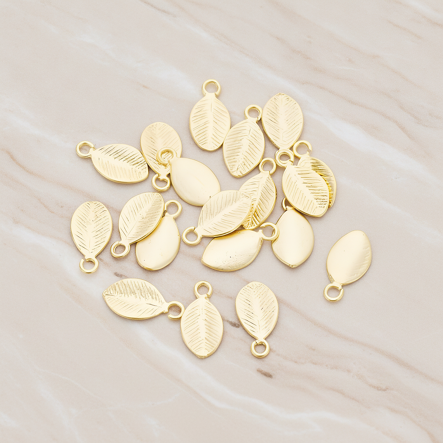 Mini Oval Leaf Pendant, 6 Pc on warm marble background (PD.1208)