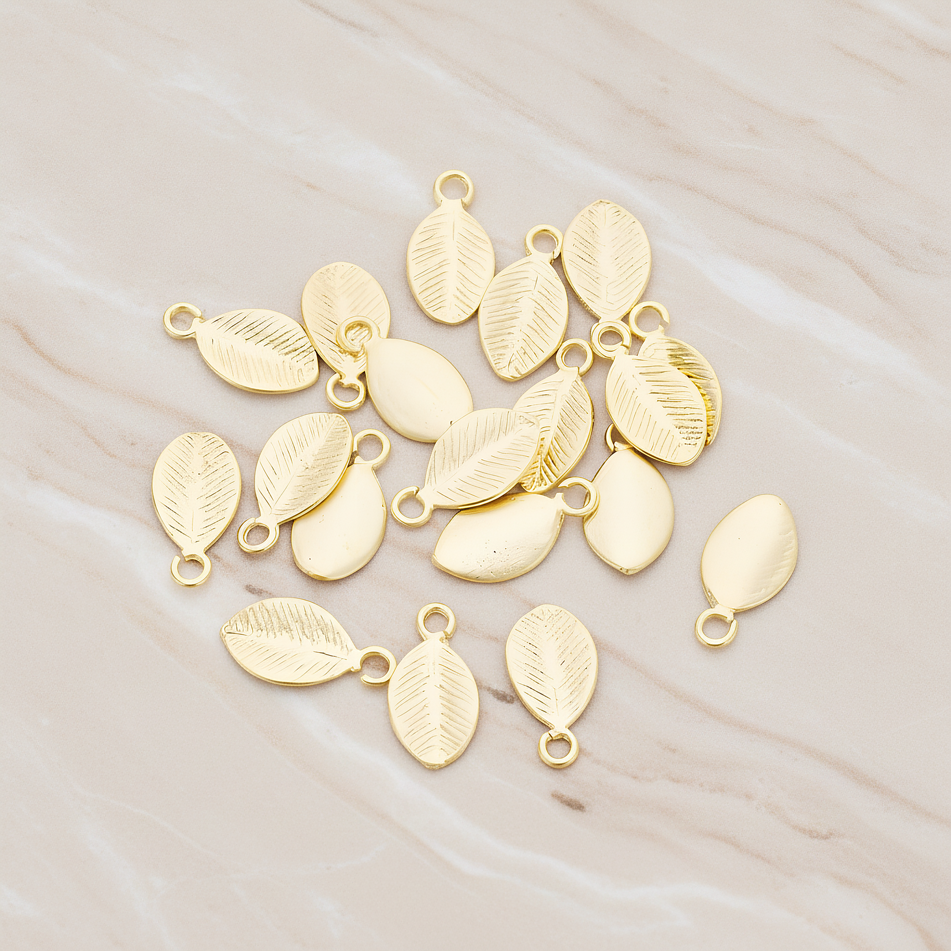 Mini Oval Leaf Pendant, 6 Pc on warm marble background (PD.1208)