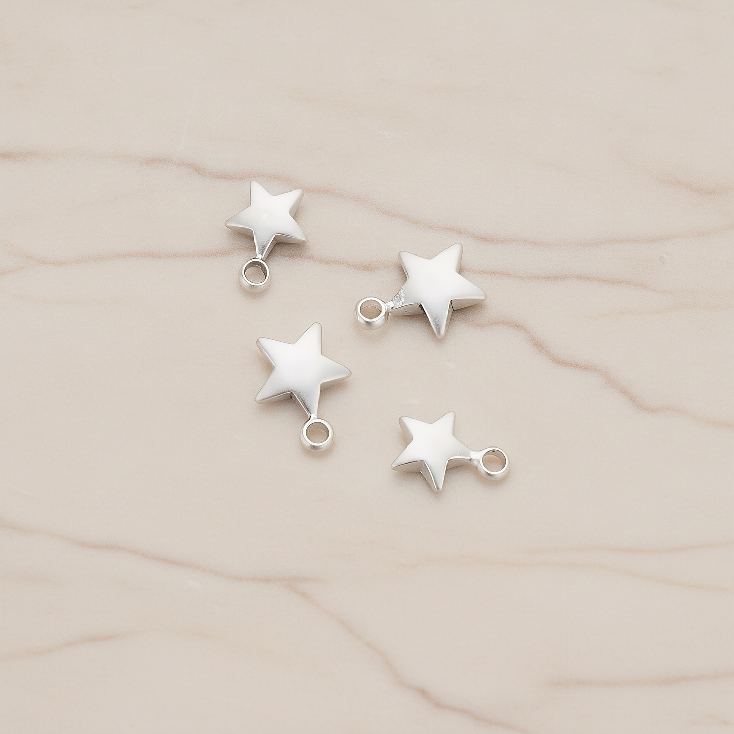 Mini 3D Star Pendant, 4 Pc on warm marble background (PD.1211)