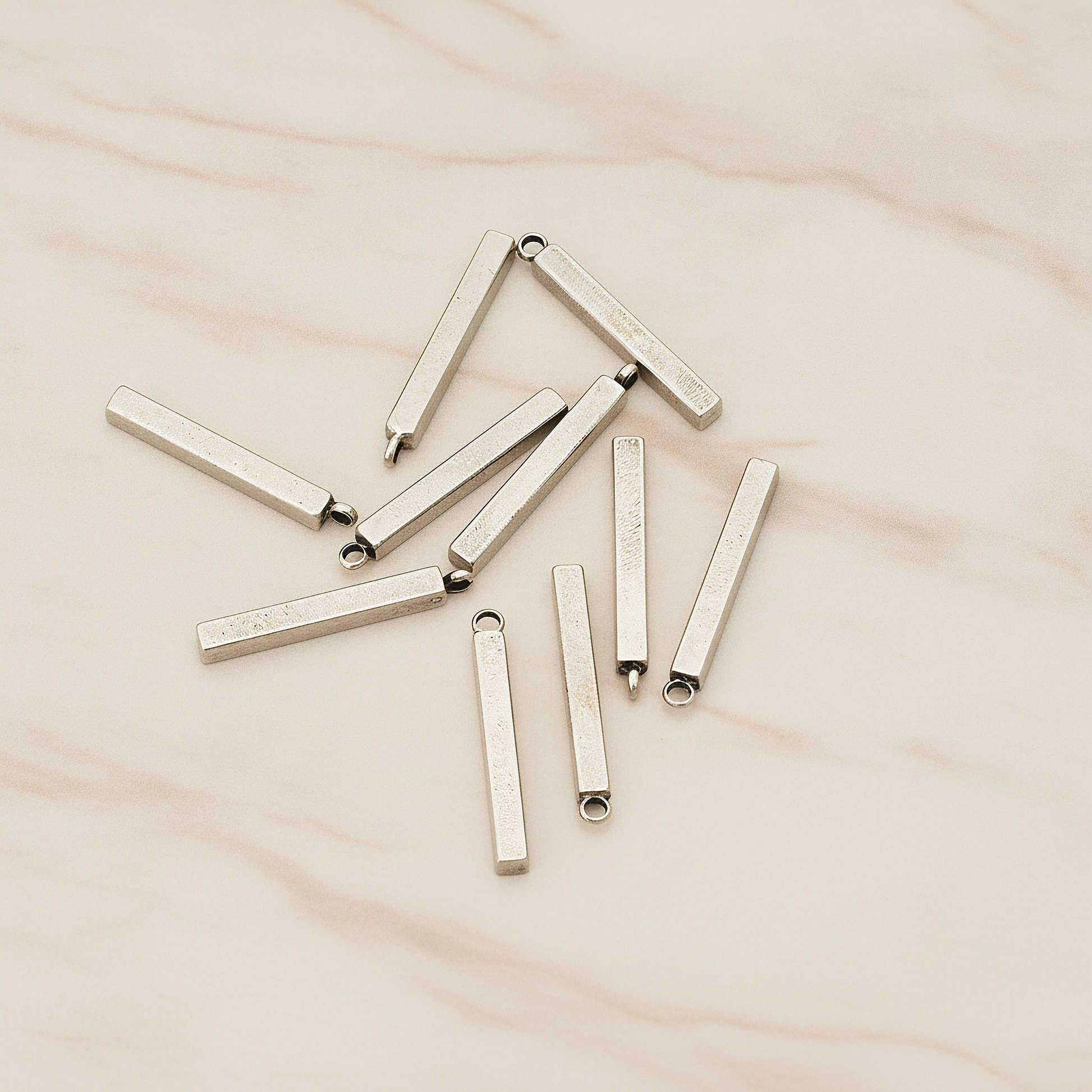 Mini Short Rectangle Bar Pendant, 4 Pc on warm marble background (PD.1228)
