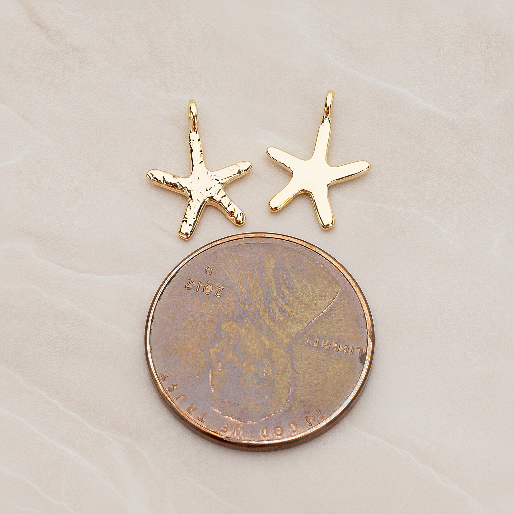 Skinny Starfish Pendant, 2 Pc on warm marble background (PD.1319-01)