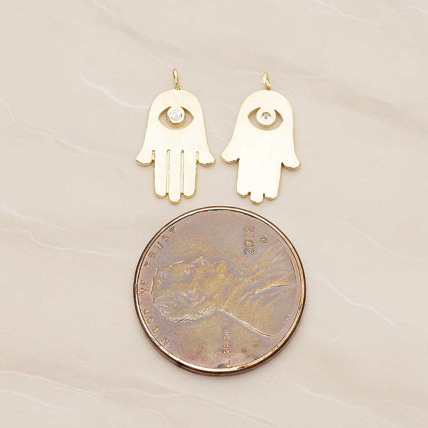 Cubic Setting Brushed Hamsa Pendant, 2 Pc on warm marble background (PD.1358)