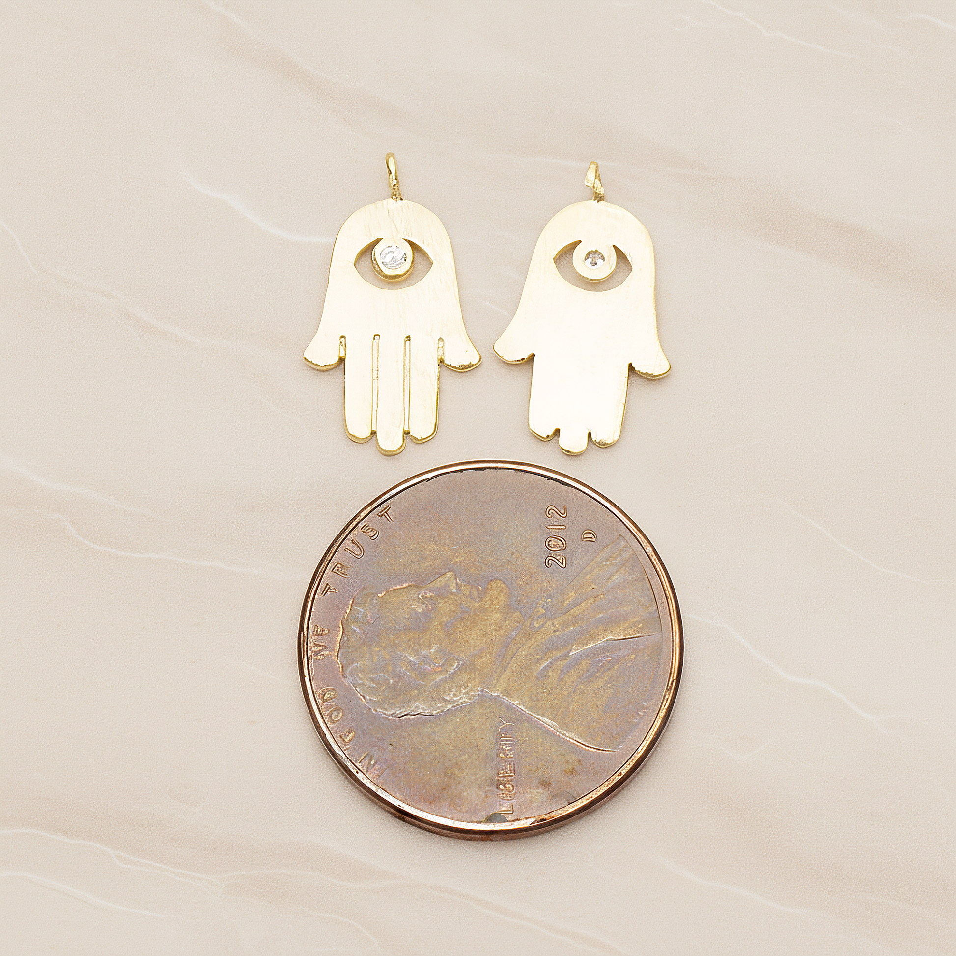 Cubic Setting Brushed Hamsa Pendant, 2 Pc on warm marble background (PD.1358)
