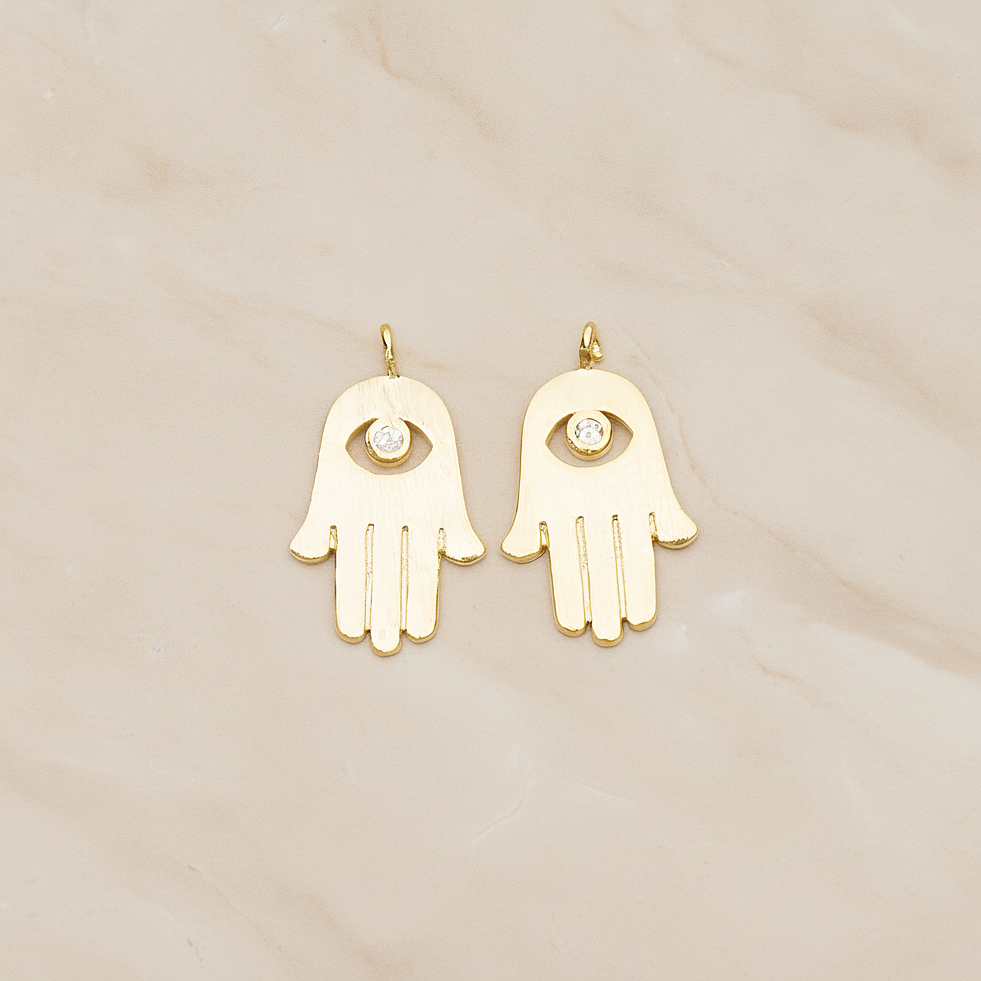 Cubic Setting Brushed Hamsa Pendant, 2 Pc on warm marble background (PD.1358)