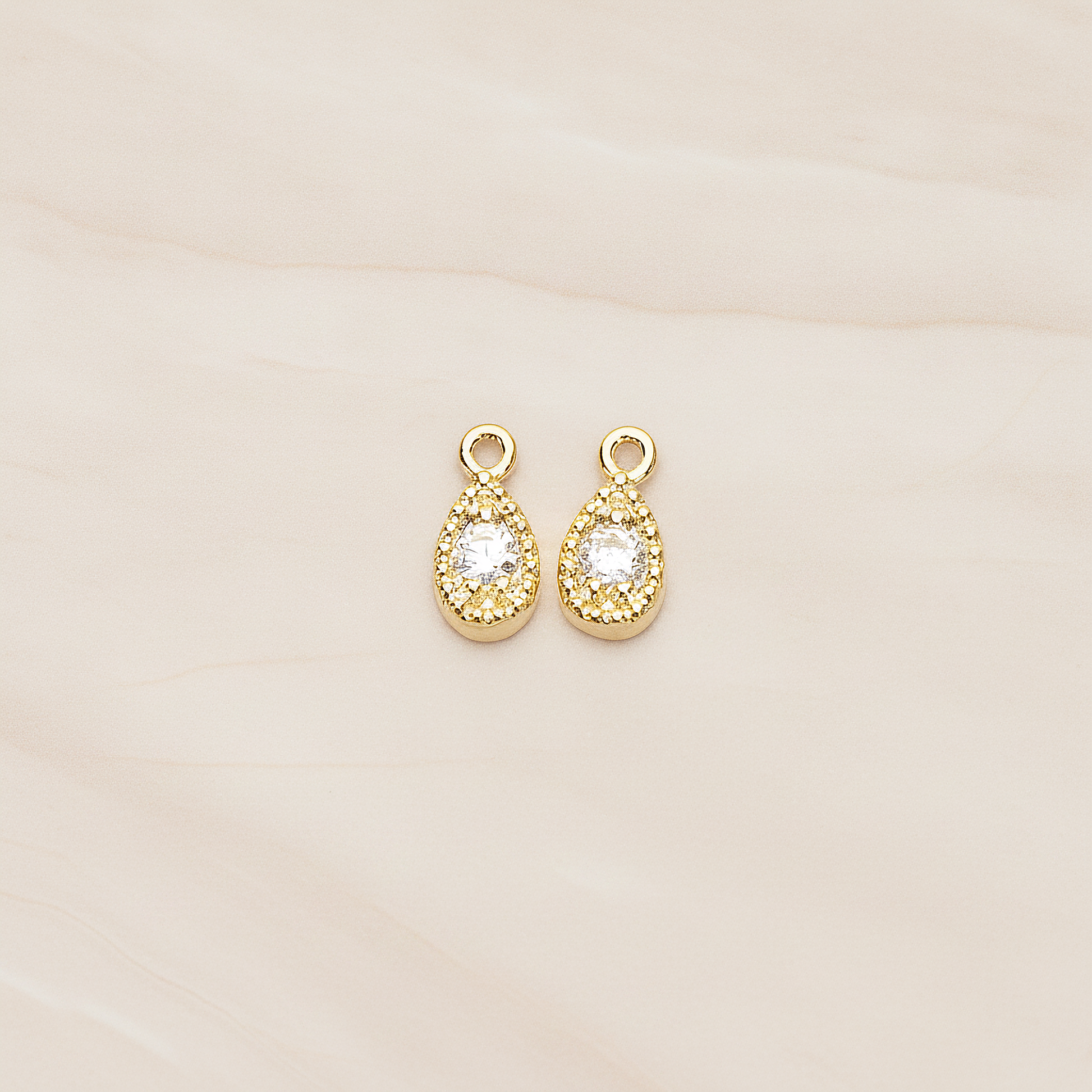 Oval Cubic Setting Textured Frame Mini Teardrop Pendant, 2 Pc on warm marble background (PD.1389)