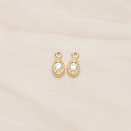 Oval Cubic Setting Textured Frame Mini Teardrop Pendant, 2 Pc on warm marble background (PD.1389)