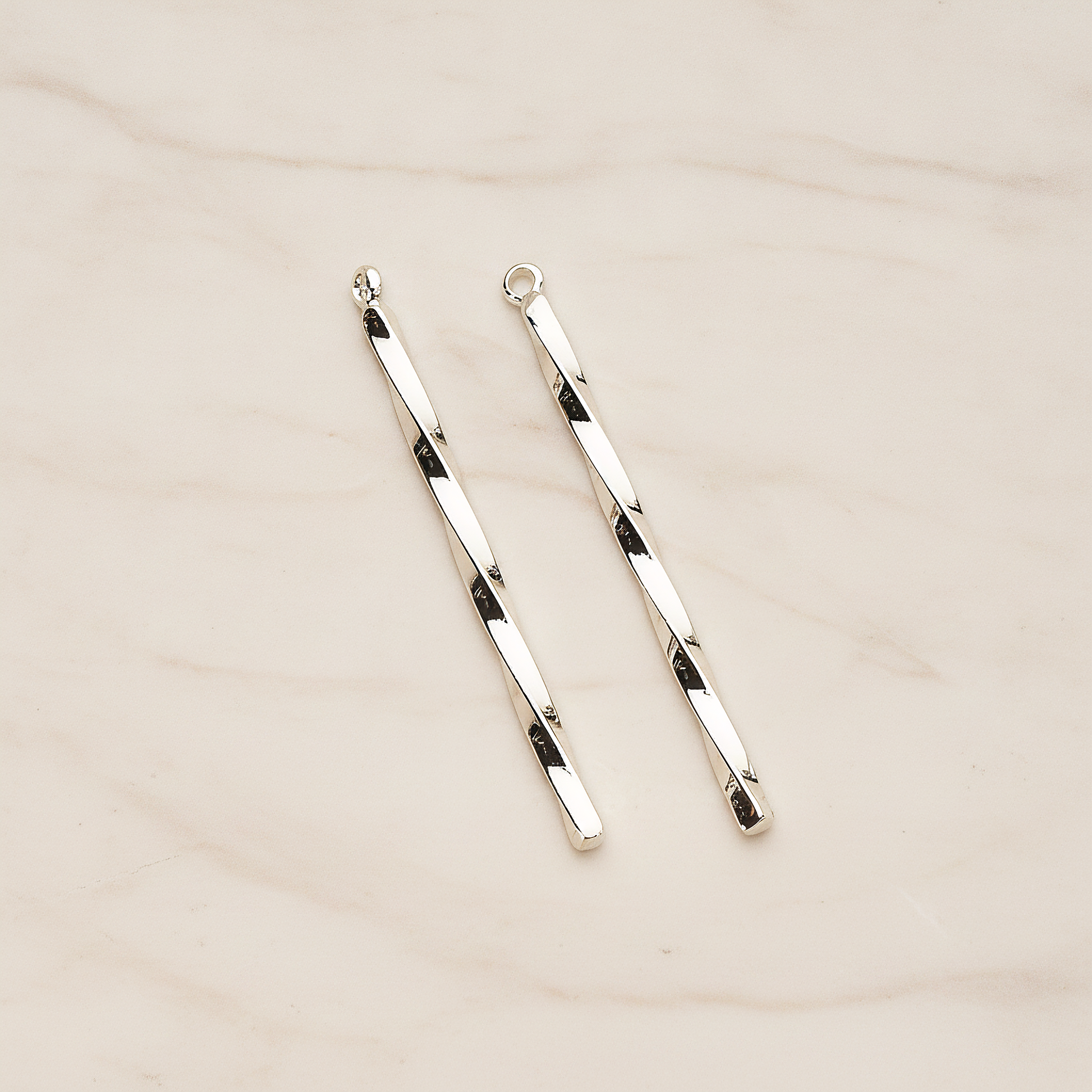 42mm Simple Twisted Vertical Bar Pendant, 2 Pc on warm marble background (PD.1433-01)