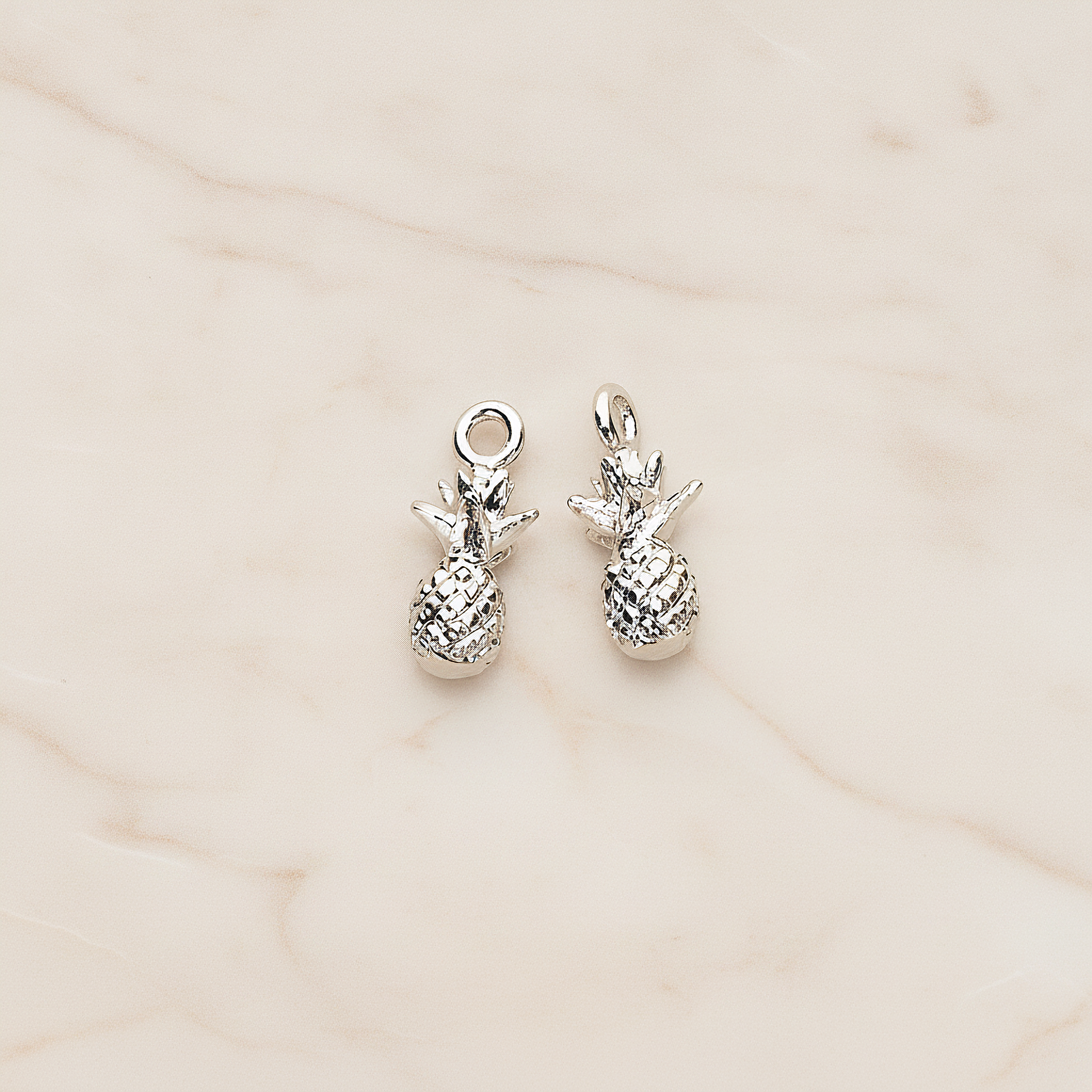 3D Realistic Baby Pineapple Charm Pendant, 2 Pc on warm marble background (PD.1461)