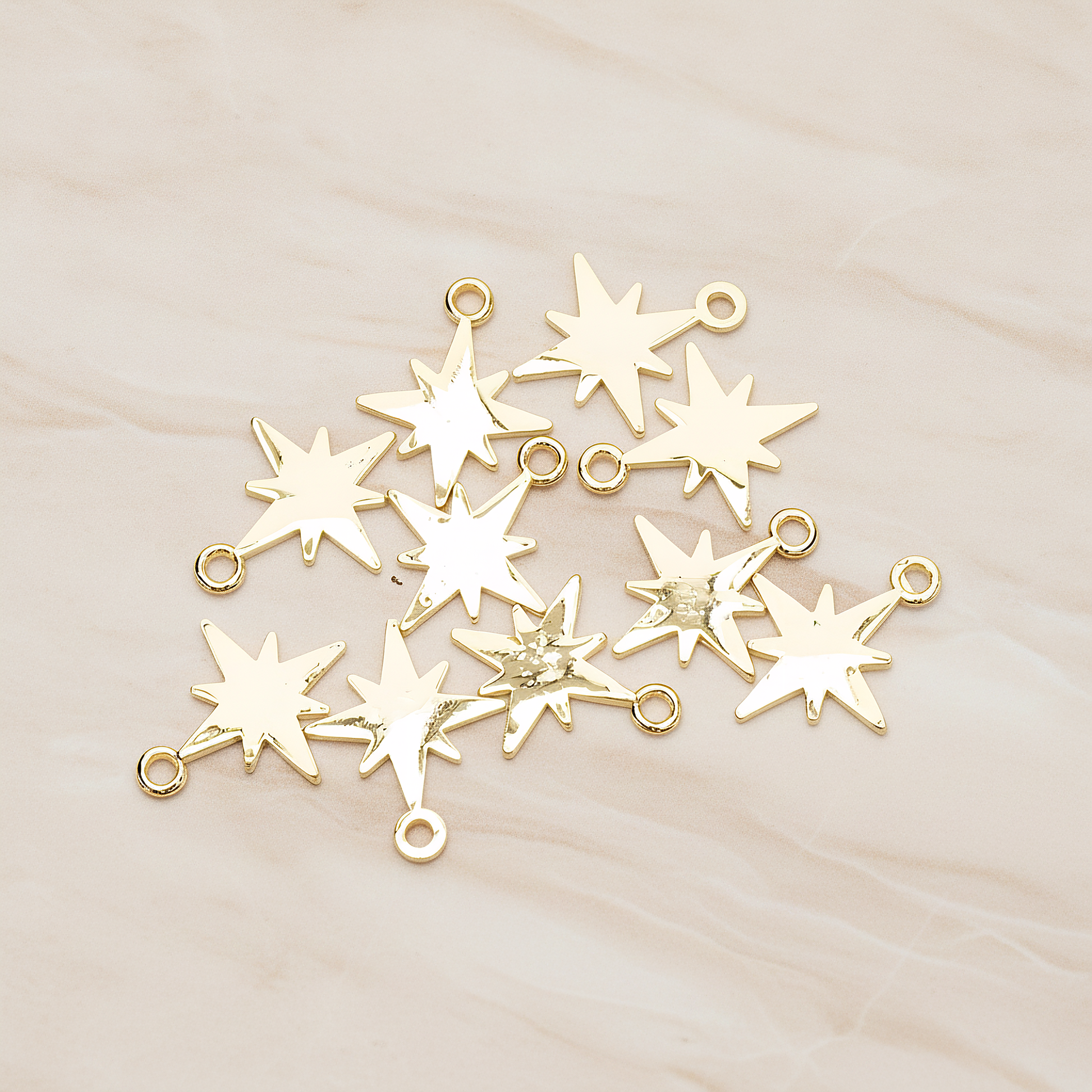 Simple Bright Shinny Star Charm Pendant, 2 Pc on warm marble background (PD.1480)