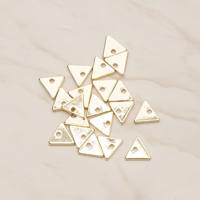 Simple Geometric 7 Mm Triangle Charm Pendant, 4 Pc on warm marble background (PD.1485)