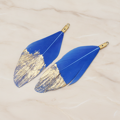 Artificiality Feather Half Dipped in Gold Pendant, 2 Pc on warm marble background (PD.1492-01)
