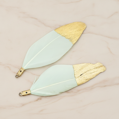 Artificiality Feather Half Dipped in Gold Pendant, 2 Pc on warm marble background (PD.1492-01)