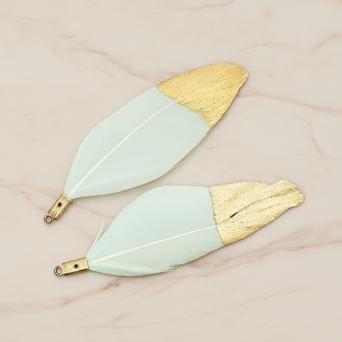 Artificiality Feather Half Dipped in Gold Pendant, 2 Pc on warm marble background (PD.1492-01)