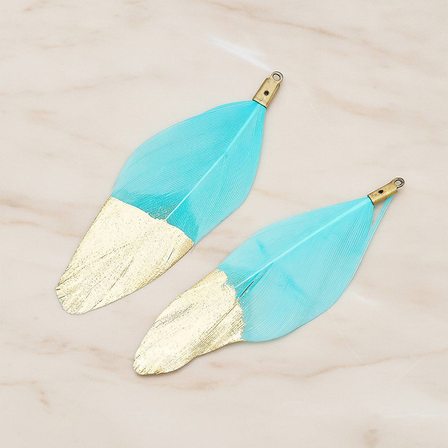 Artificiality Feather Half Dipped in Gold Pendant, 2 Pc on warm marble background (PD.1492-01)