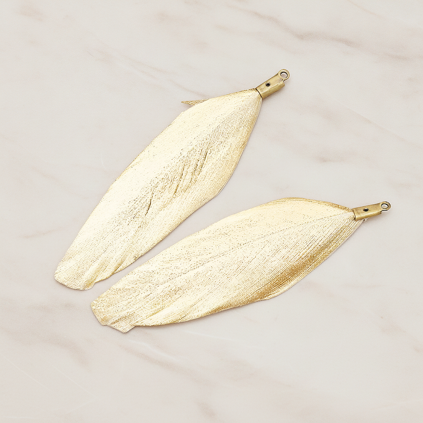 Artificiality Feather Charm Pendant, 2 Pc on warm marble background (PD.1492-04)