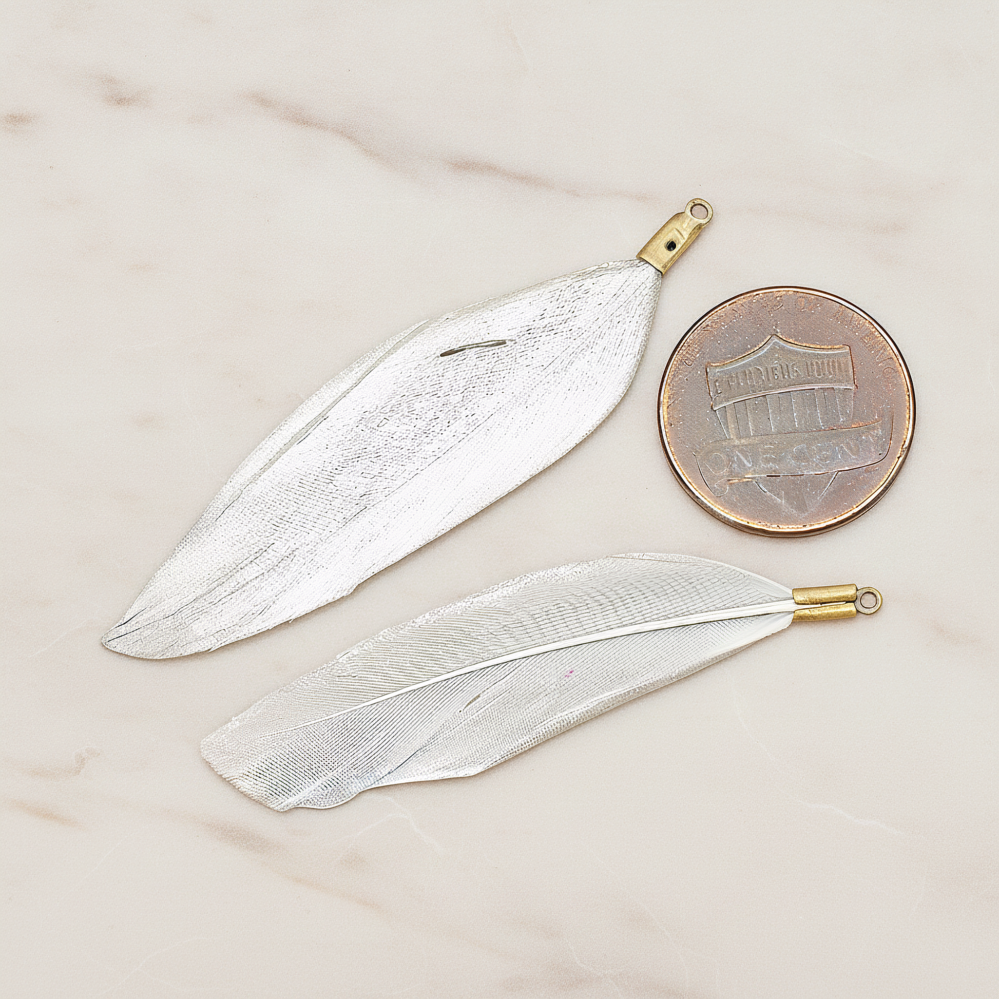 Artificiality Feather Charm Pendant, 2 Pc on warm marble background (PD.1492-04)