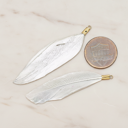 Artificiality Feather Charm Pendant, 2 Pc on warm marble background (PD.1492-04)