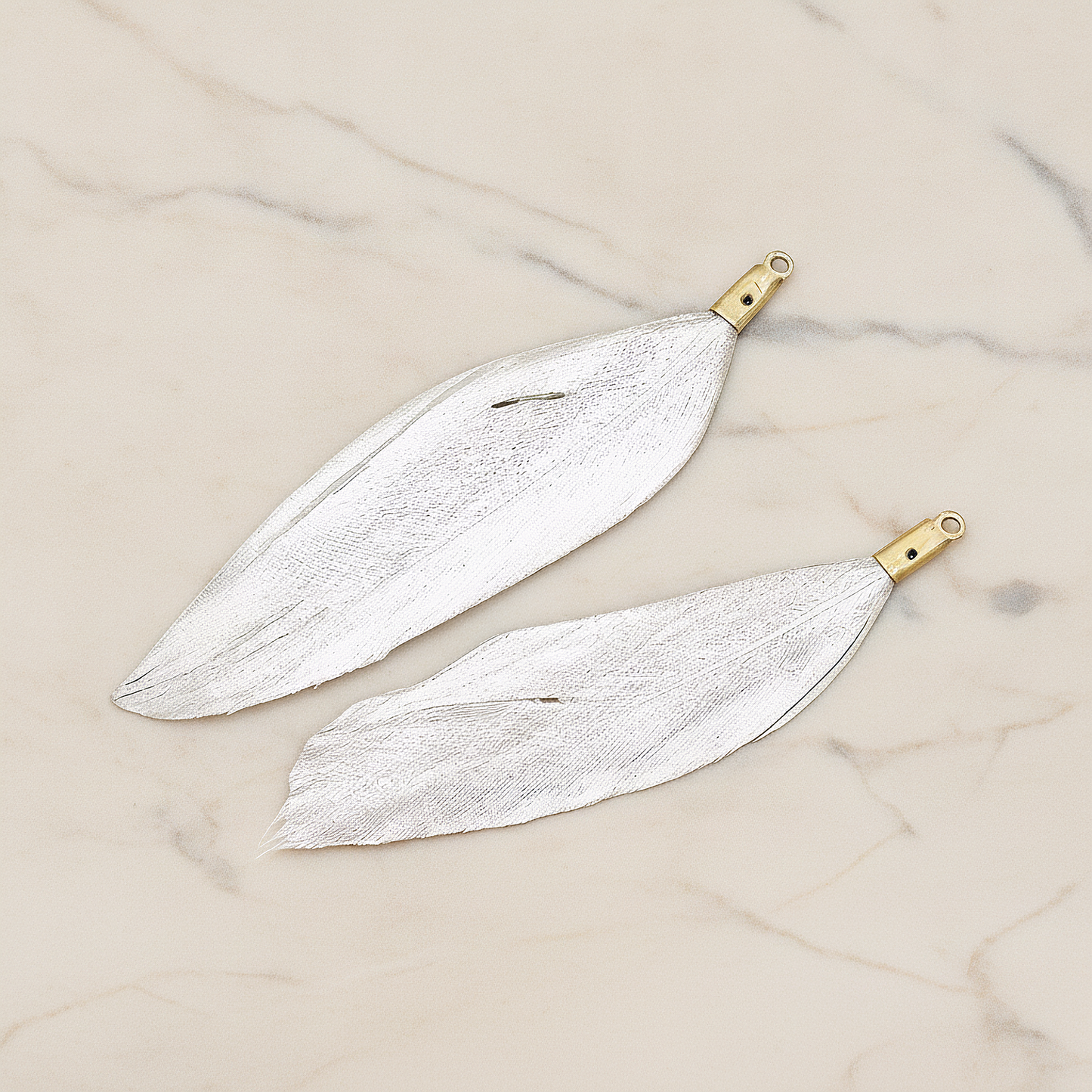 Artificiality Feather Charm Pendant, 2 Pc on warm marble background (PD.1492-04)