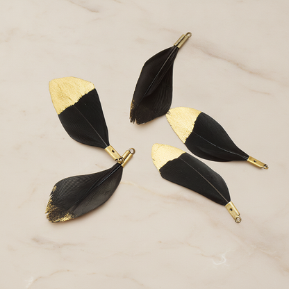 Small Artificiality Feather Half Dipped in Gold Colored Pendant, 2 Pc on warm marble background (PD.1492-05)