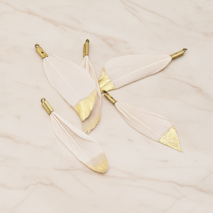 Small Artificiality Feather Half Dipped in Gold Colored Pendant, 2 Pc on warm marble background (PD.1492-05)