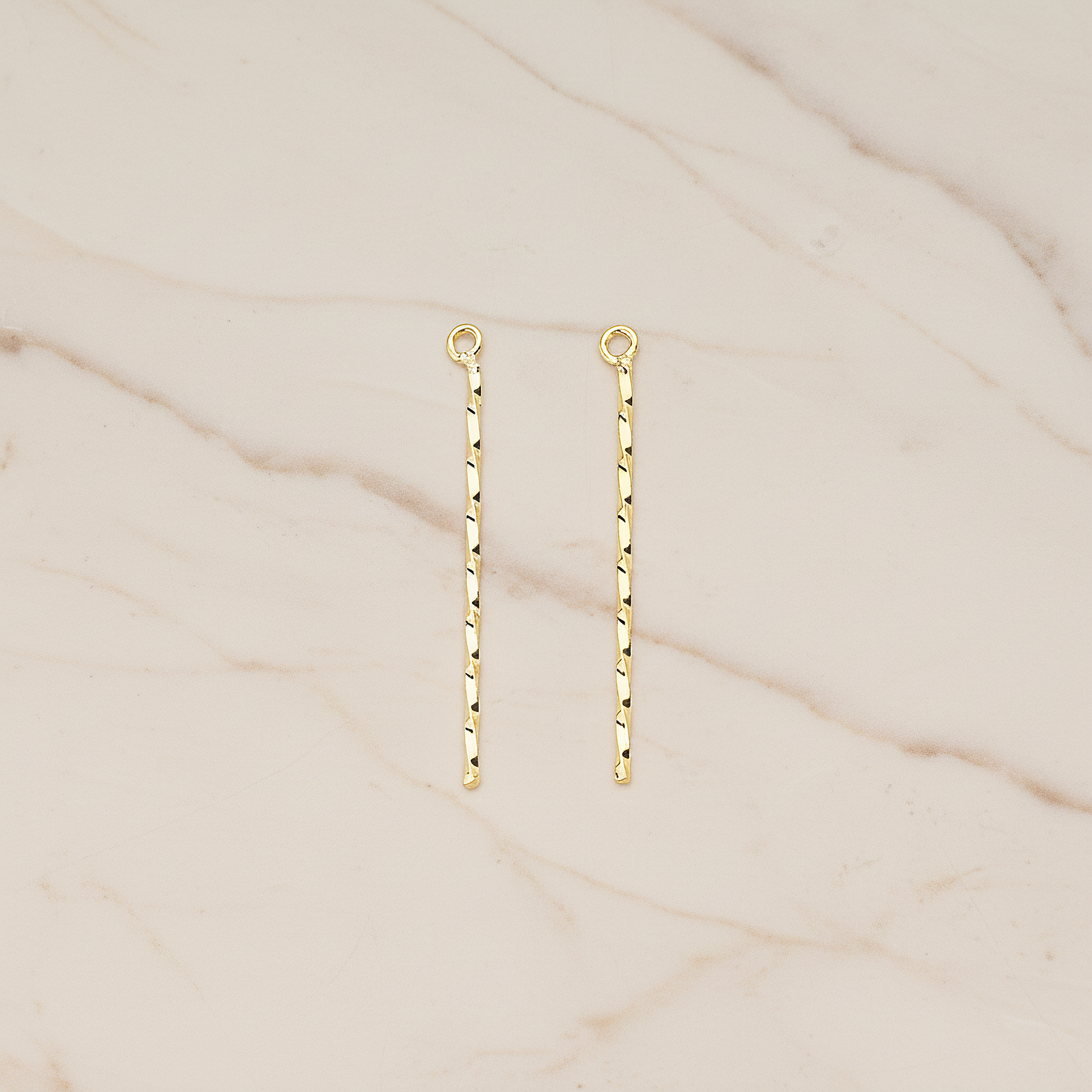 Thin Twisted Bar Charm 32mm Pendant, 2 Pc on warm marble background (PD.1571-01)