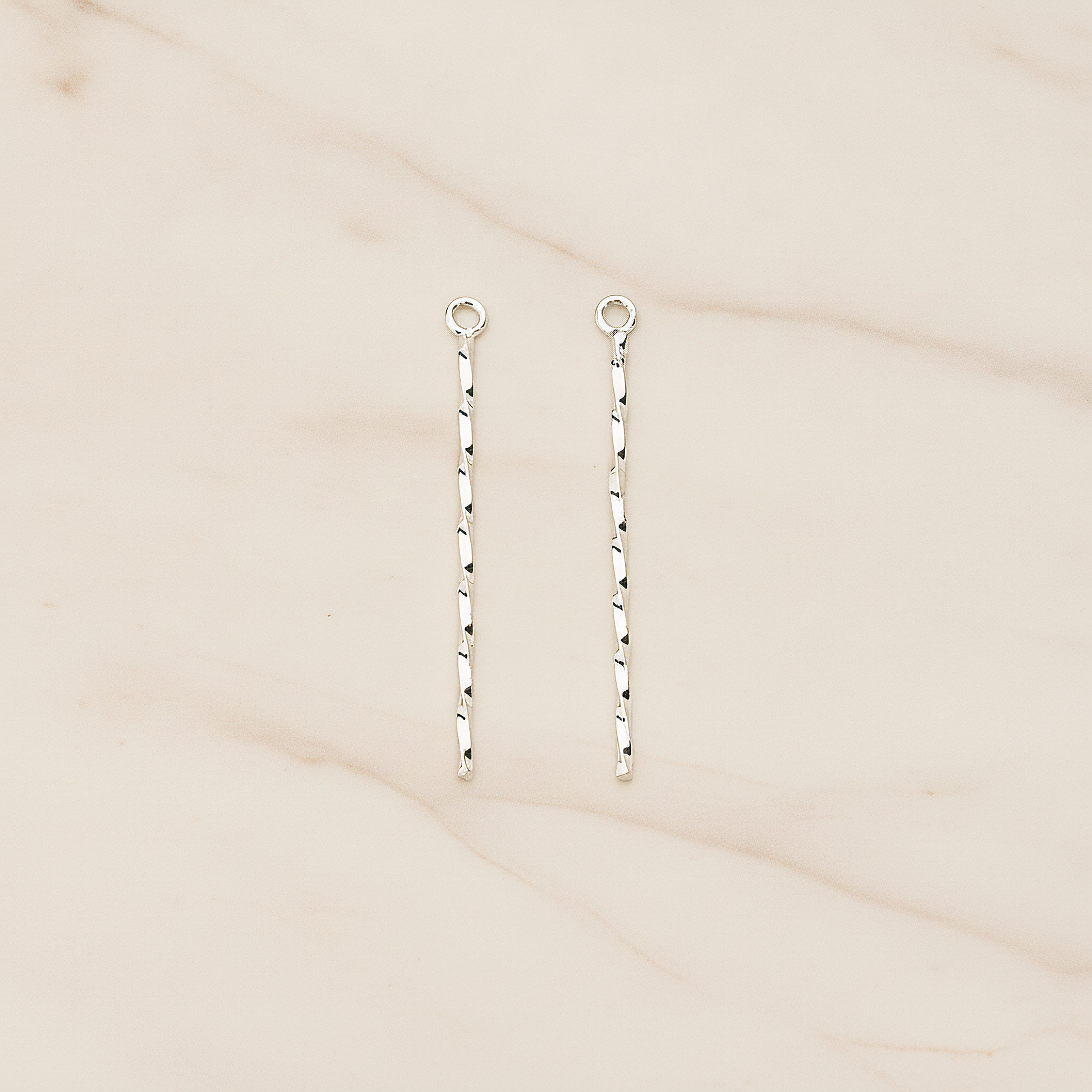 Thin Twisted Bar Charm 32mm Pendant, 2 Pc on warm marble background (PD.1571-01)