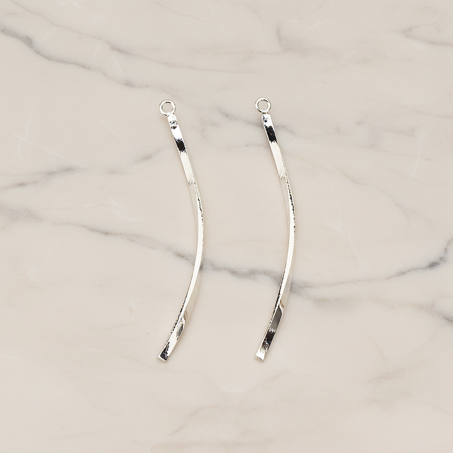 Curved Flattened Twisted Bar Charm 42mm Pendant, 2 Pc on warm marble background (PD.1575-01)