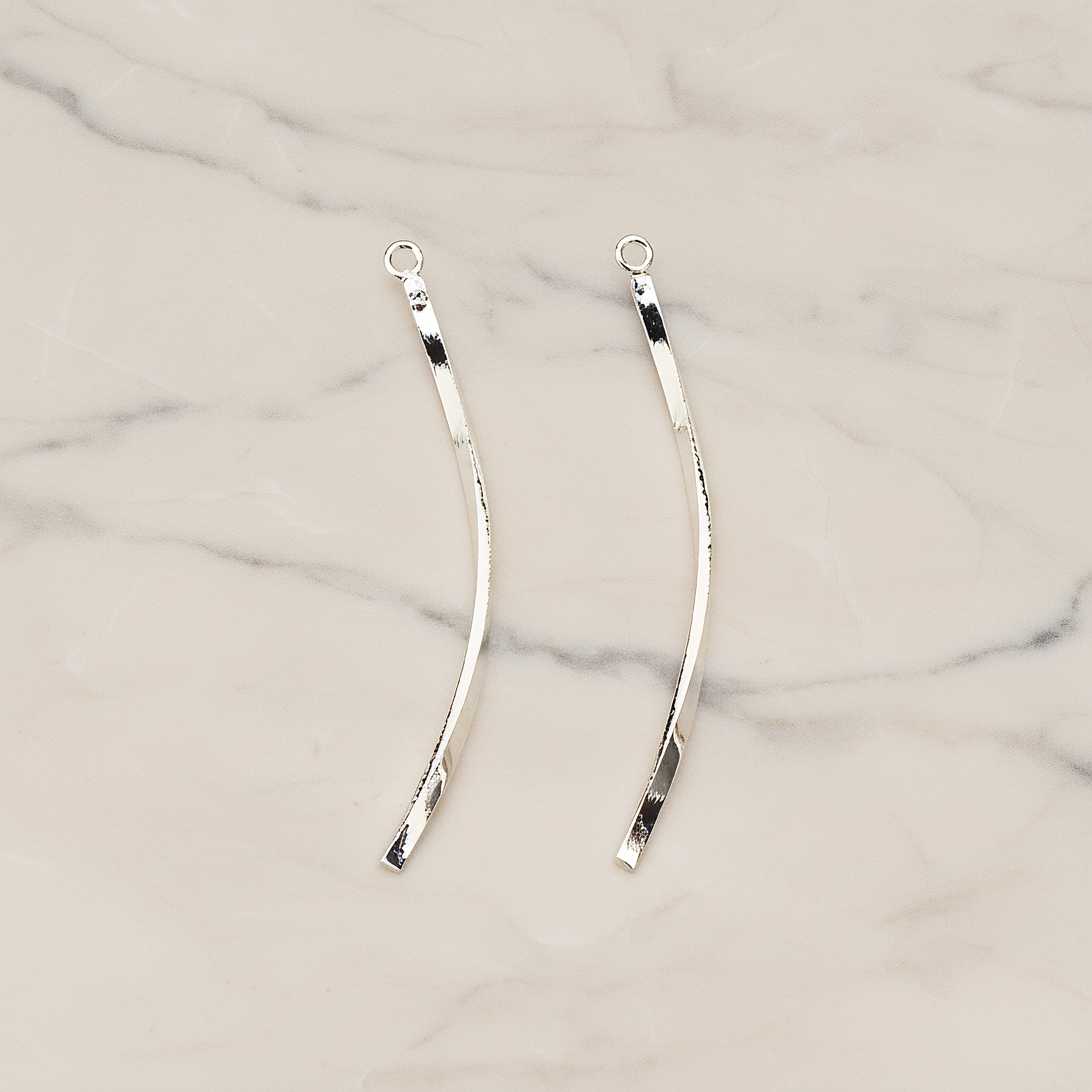 Curved Flattened Twisted Bar Charm 42mm Pendant, 2 Pc on warm marble background (PD.1575-01)