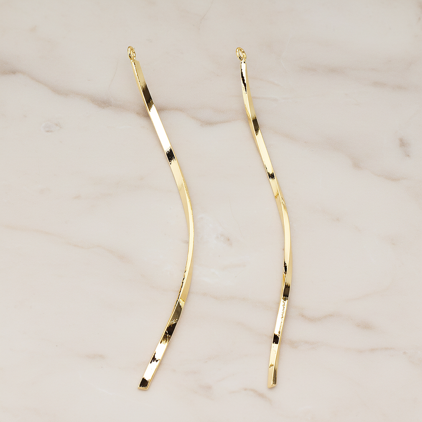 Curved Flattened Twisted Long Bar Charm 62mm Pendant, 2 Pc on warm marble background (PD.1575-02)