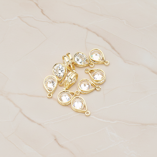Double Teardrop Sandwitch Framed Cubic Ziconia Charm Pendant, 2 Pc on warm marble background (PD.1579-01)