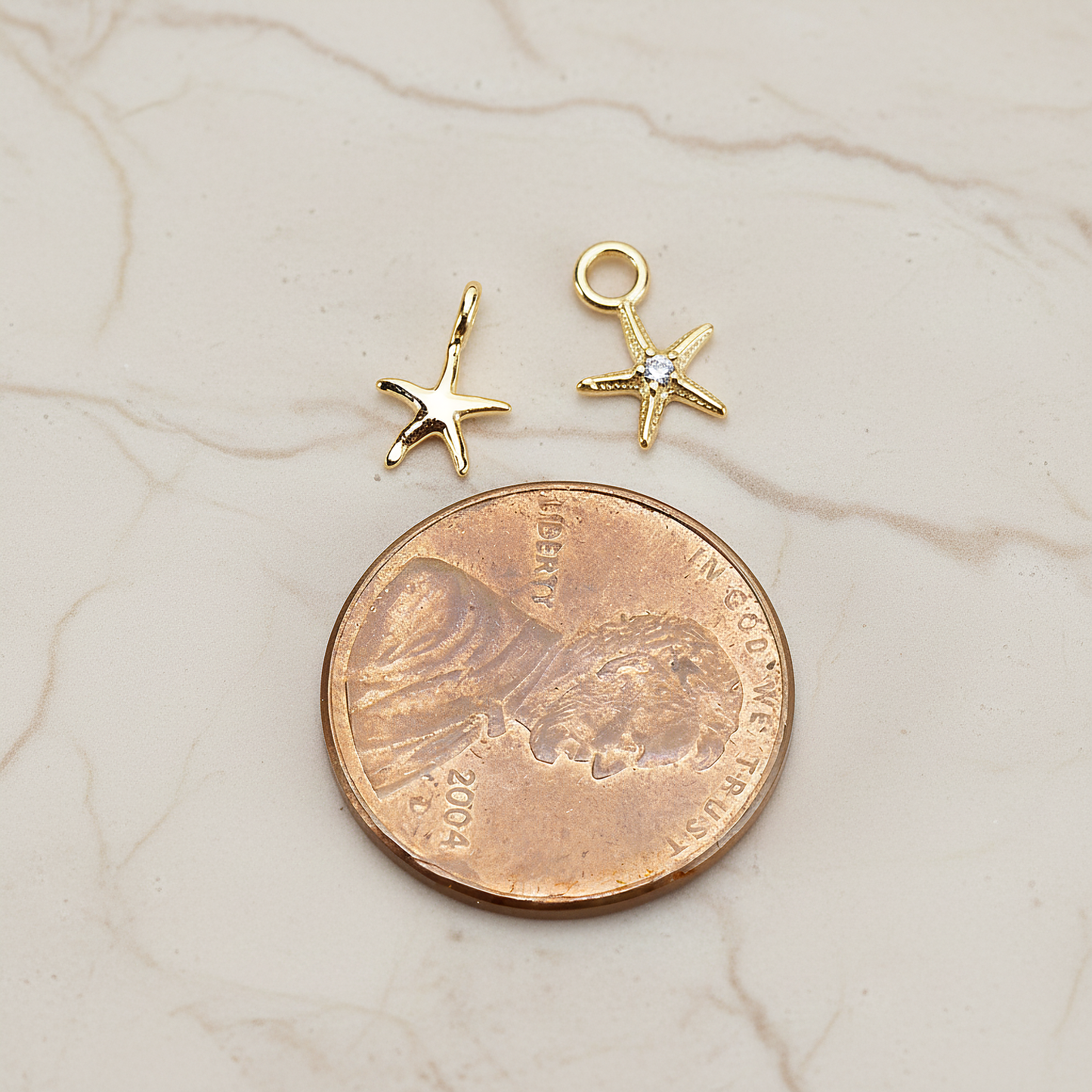 Tiny Starfish Pendant, 2 Pc on warm marble background (PD.1615)