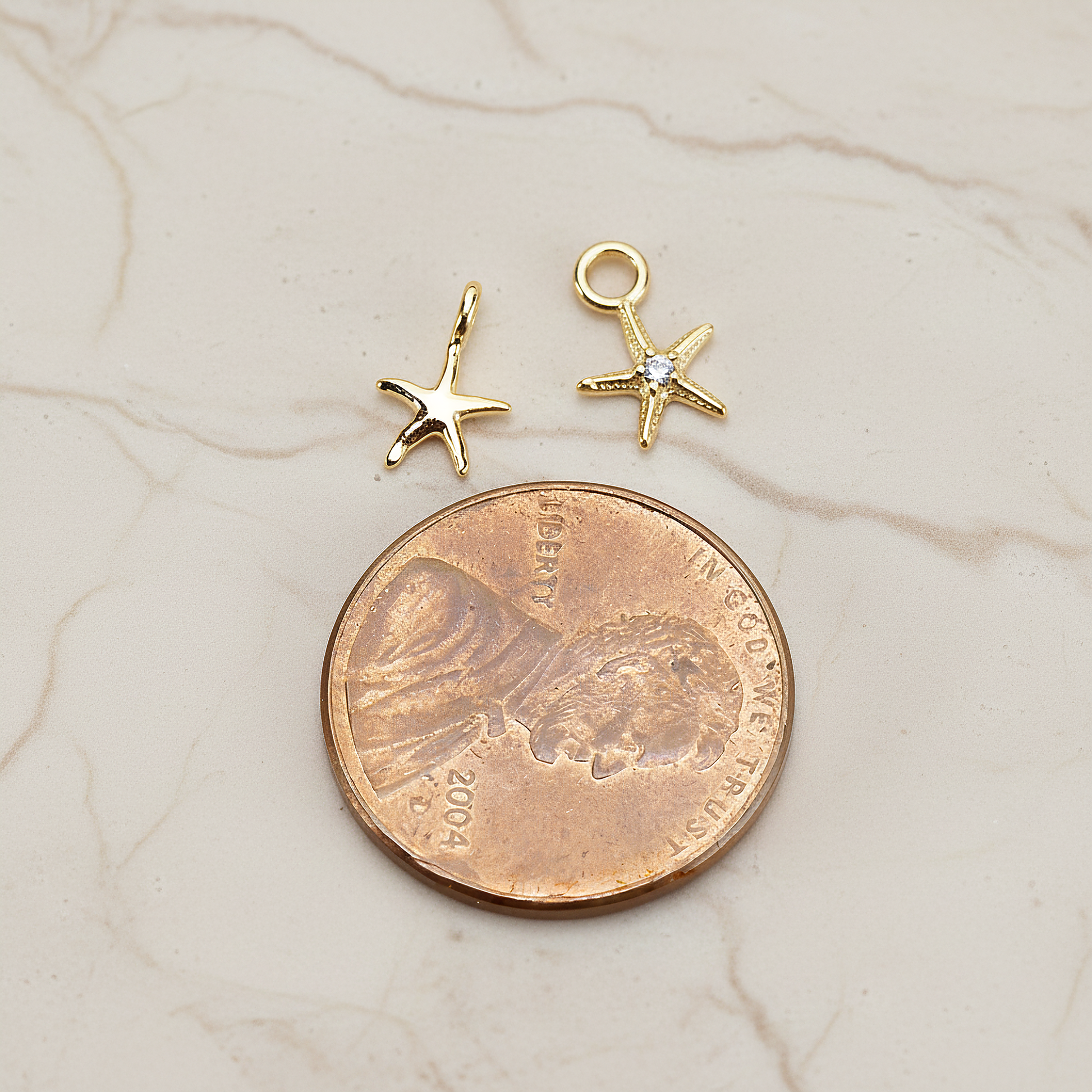 Tiny Starfish Pendant, 2 Pc on warm marble background (PD.1615)