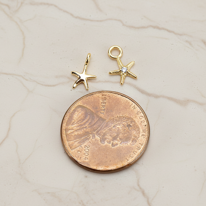Tiny Starfish Pendant, 2 Pc on warm marble background (PD.1615)