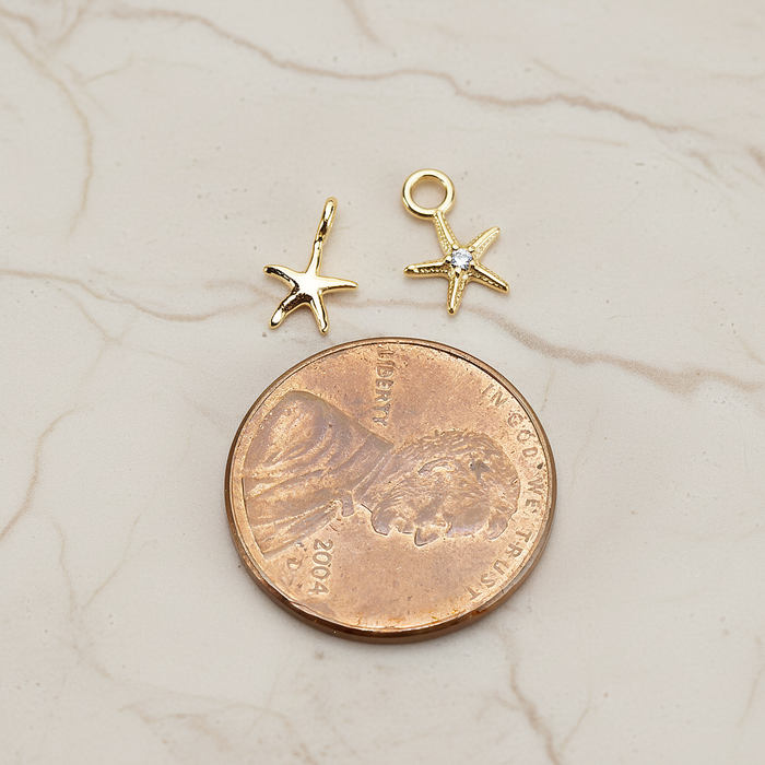 Tiny Starfish Pendant, 2 Pc on warm marble background (PD.1615)