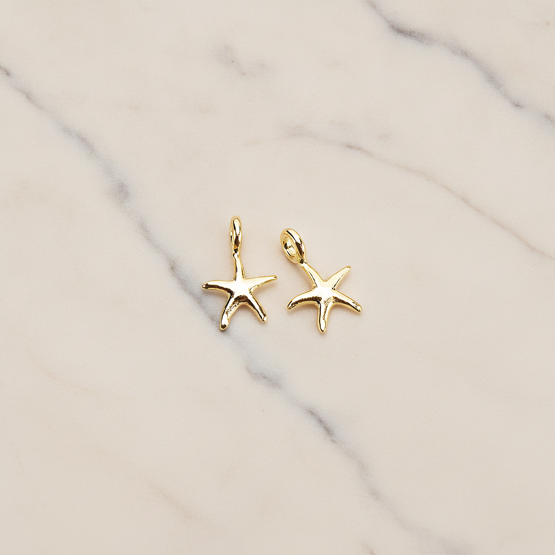 Tiny Starfish Pendant, 2 Pc on warm marble background (PD.1615)